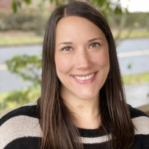 Smiling woman with long brown hair